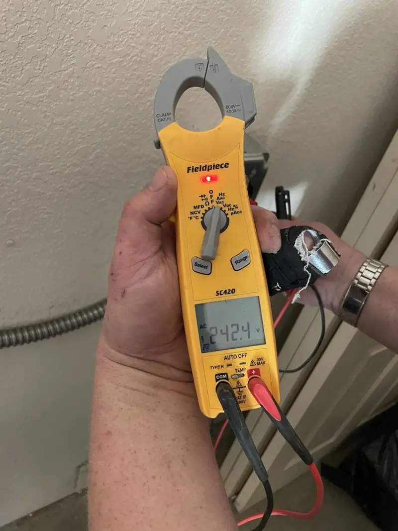Voltage testing with clamp meter during Electrical Installation Services in Chesterfield